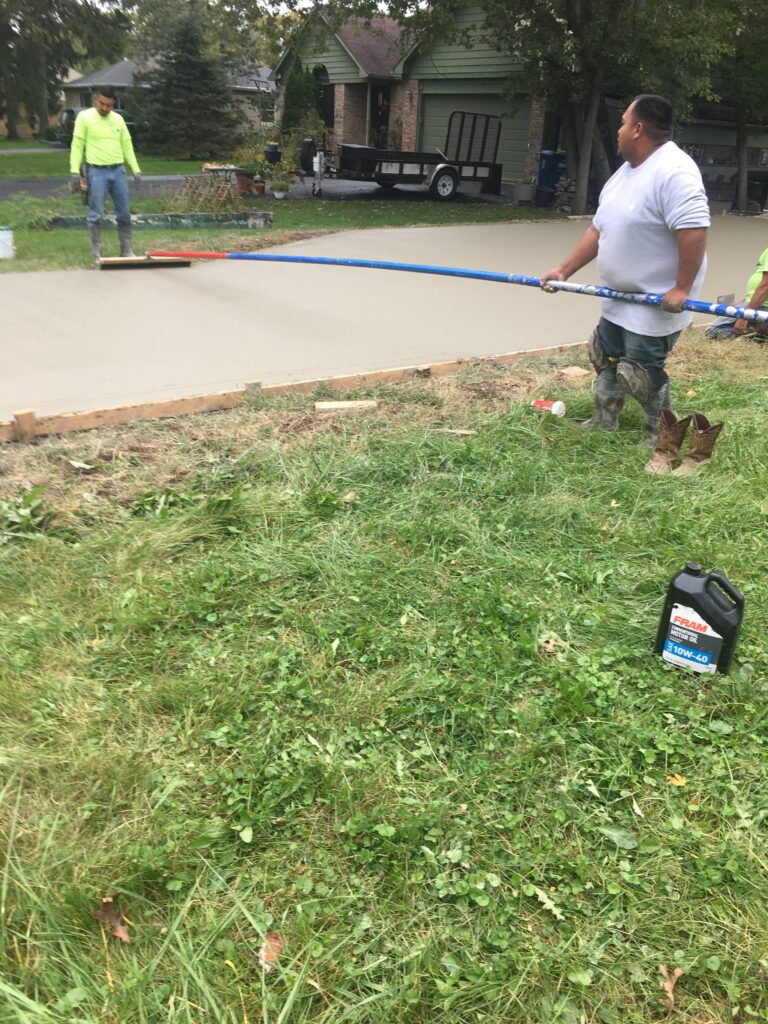Smoothing the Concrete With the Float